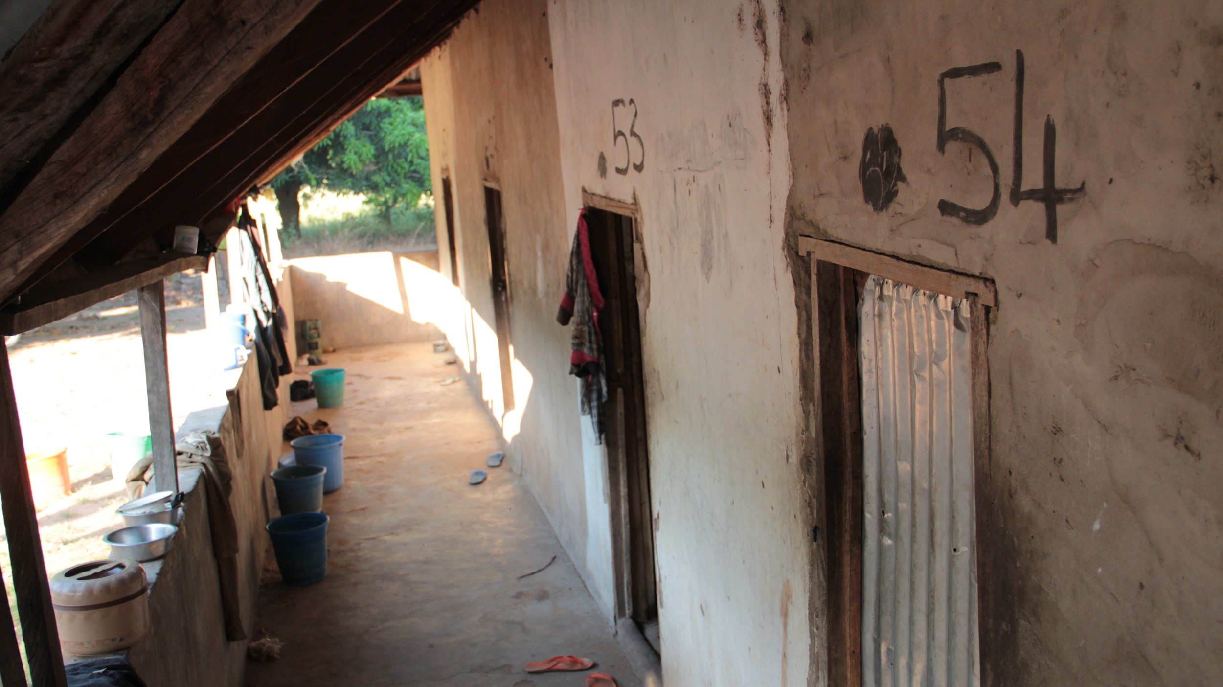  Veranda of "the monastery".&nbsp; Shoes, water pails, laundry and cooking pots collect here, like men's dorms anywhere. 