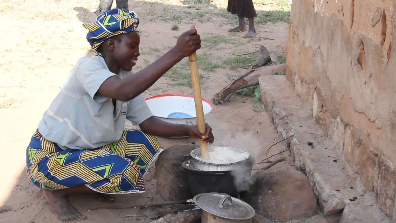  With the poor state of the kitchen huts, most cooking in the married student area is done outdoors over an open fire. 