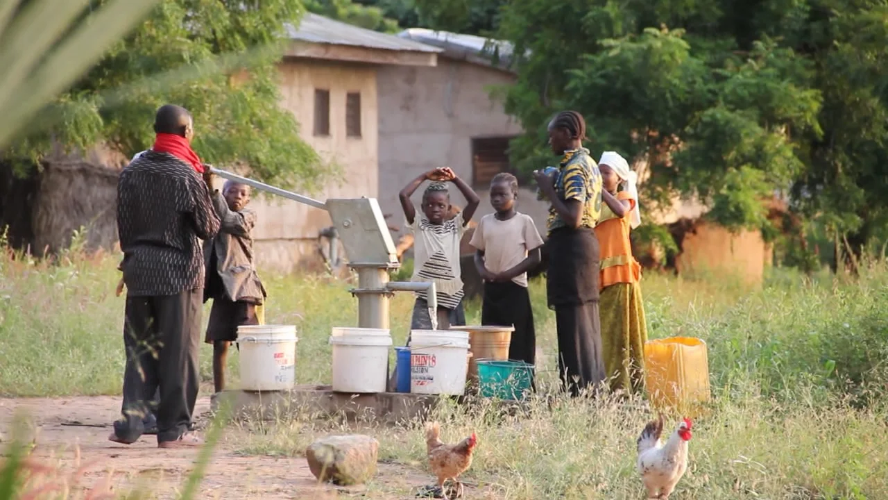 Everyone's morning ritual is to gather water for the day's washing and cooking at one of BTS's wells.