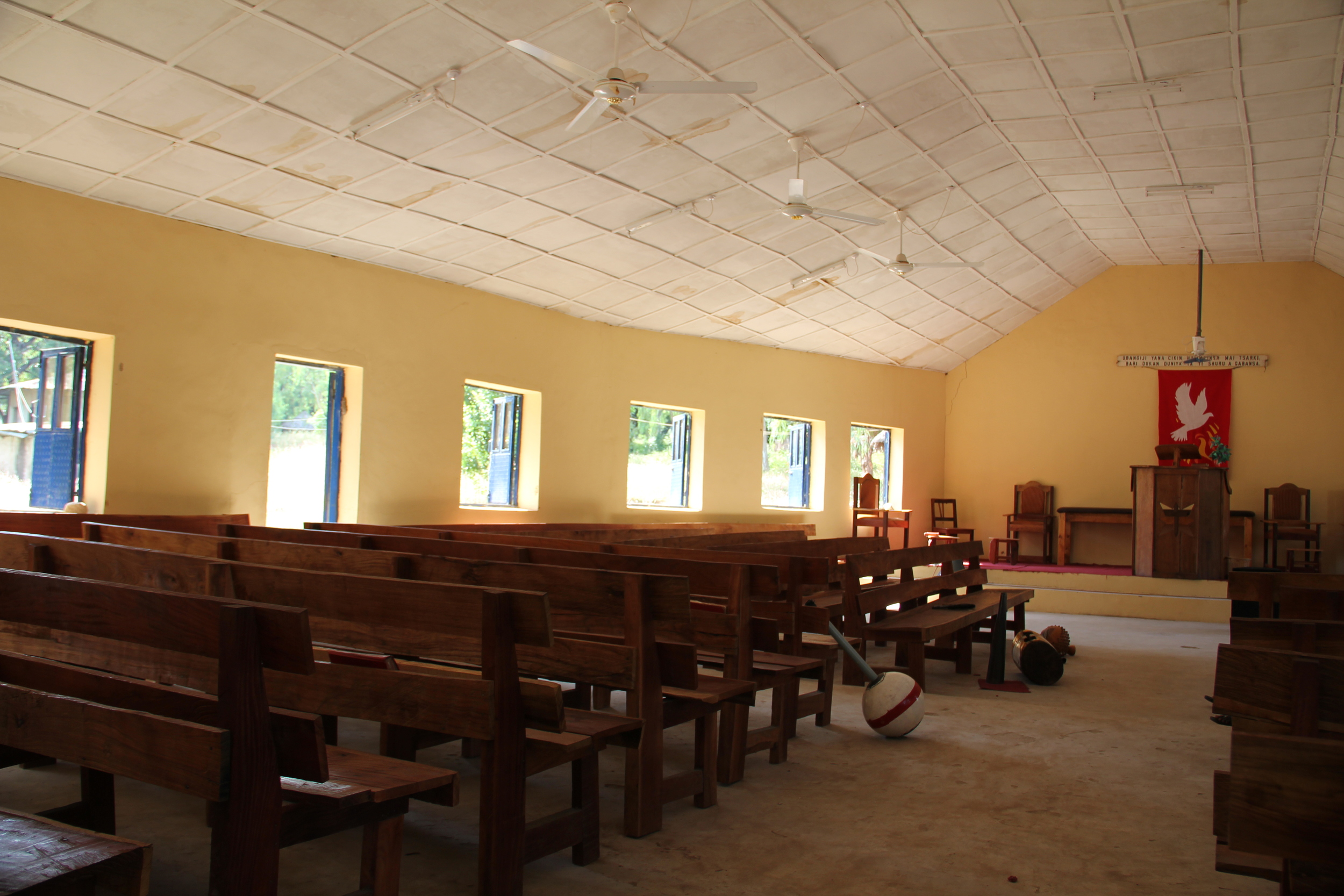  Slightly bowed walls and lots of open windows are designed to catch any available breeze to make worship more comfortable. 