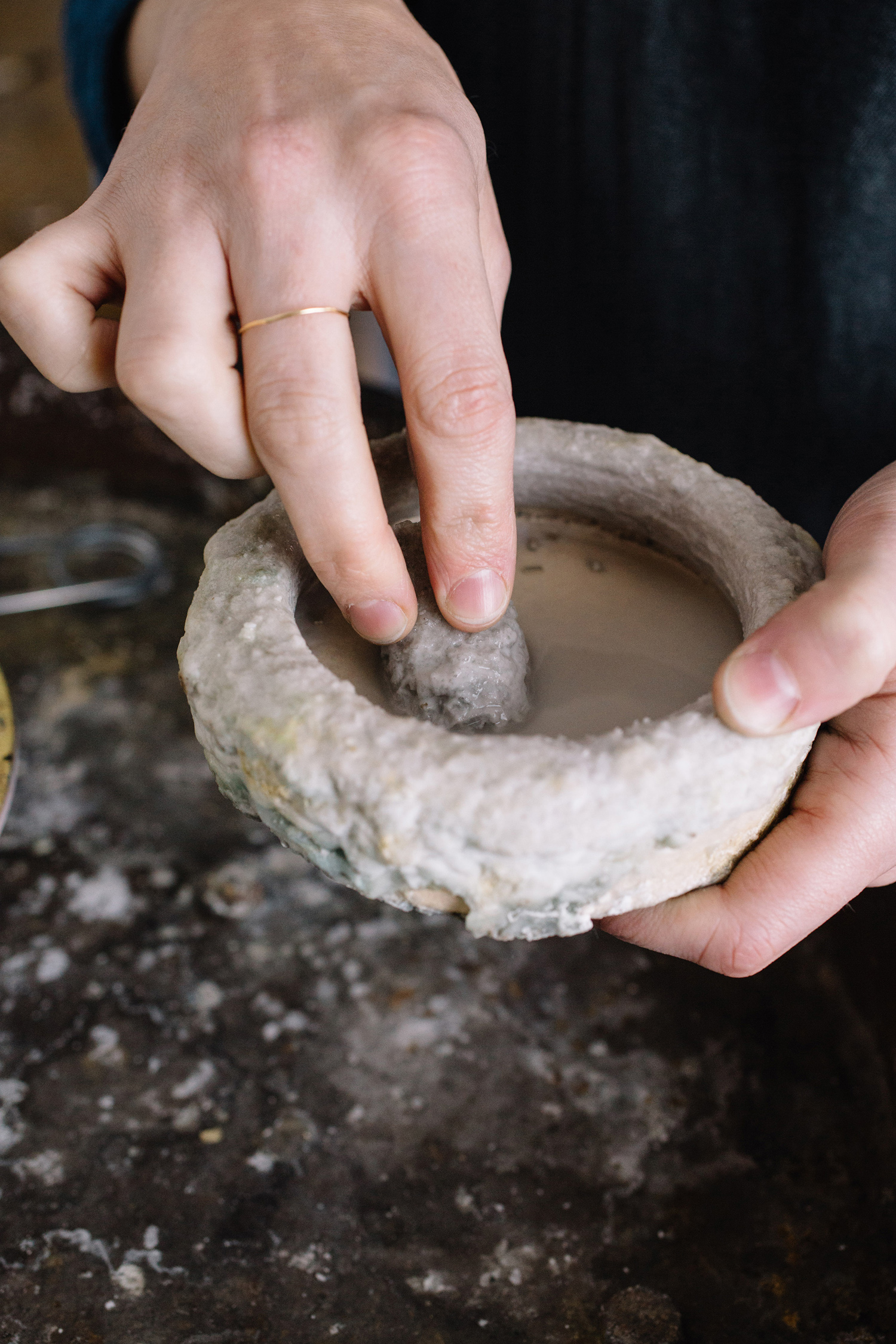 mixing flux during a wedding ring workshop