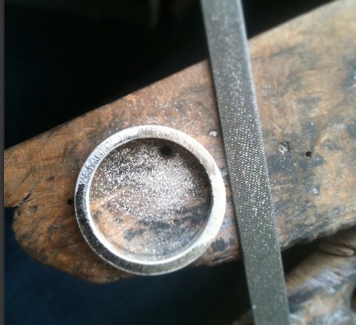 making a wedding ring at the jewellery bench 