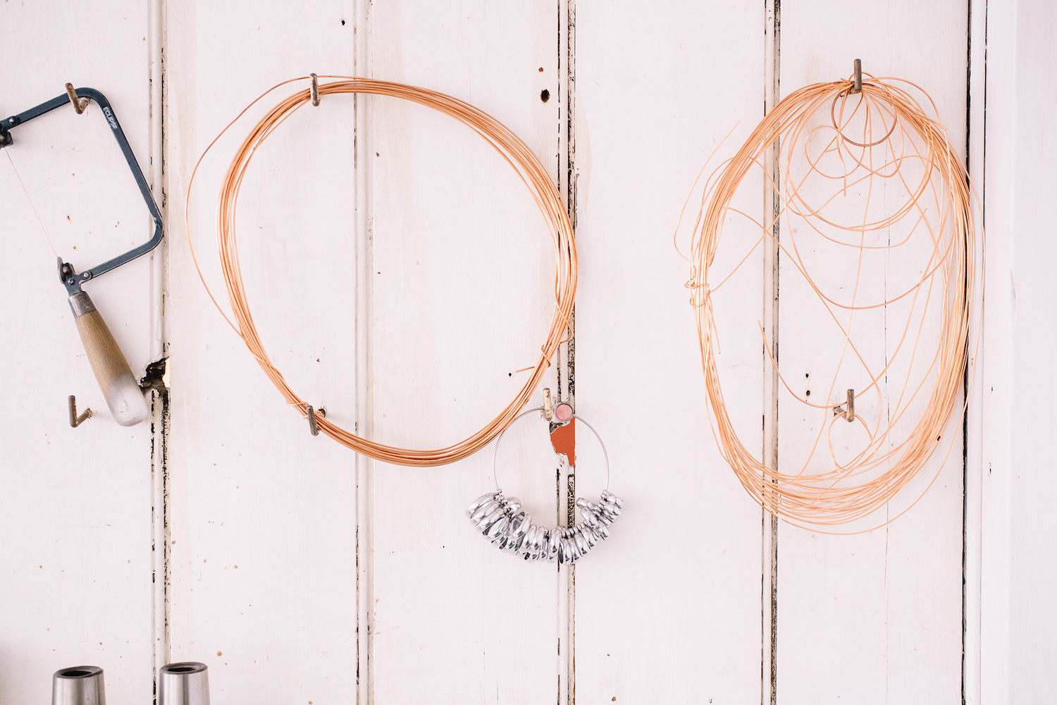 Ring sizer tool on the wall in the Jewellery workshop UK