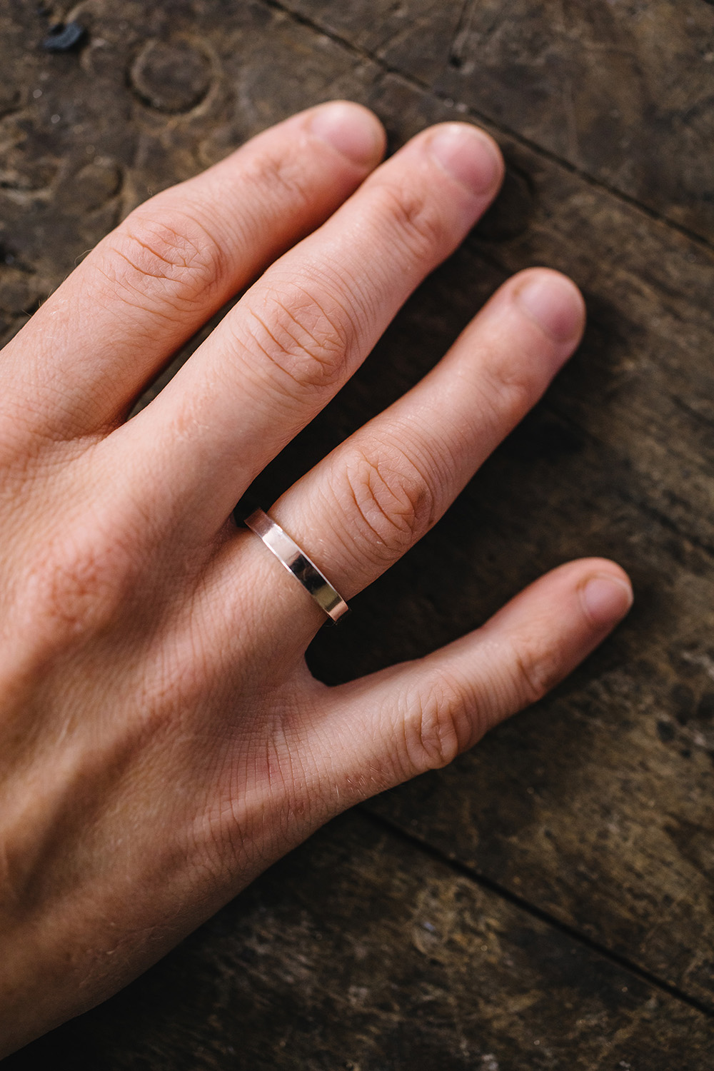 3mm wide flat wedding ring on finger 