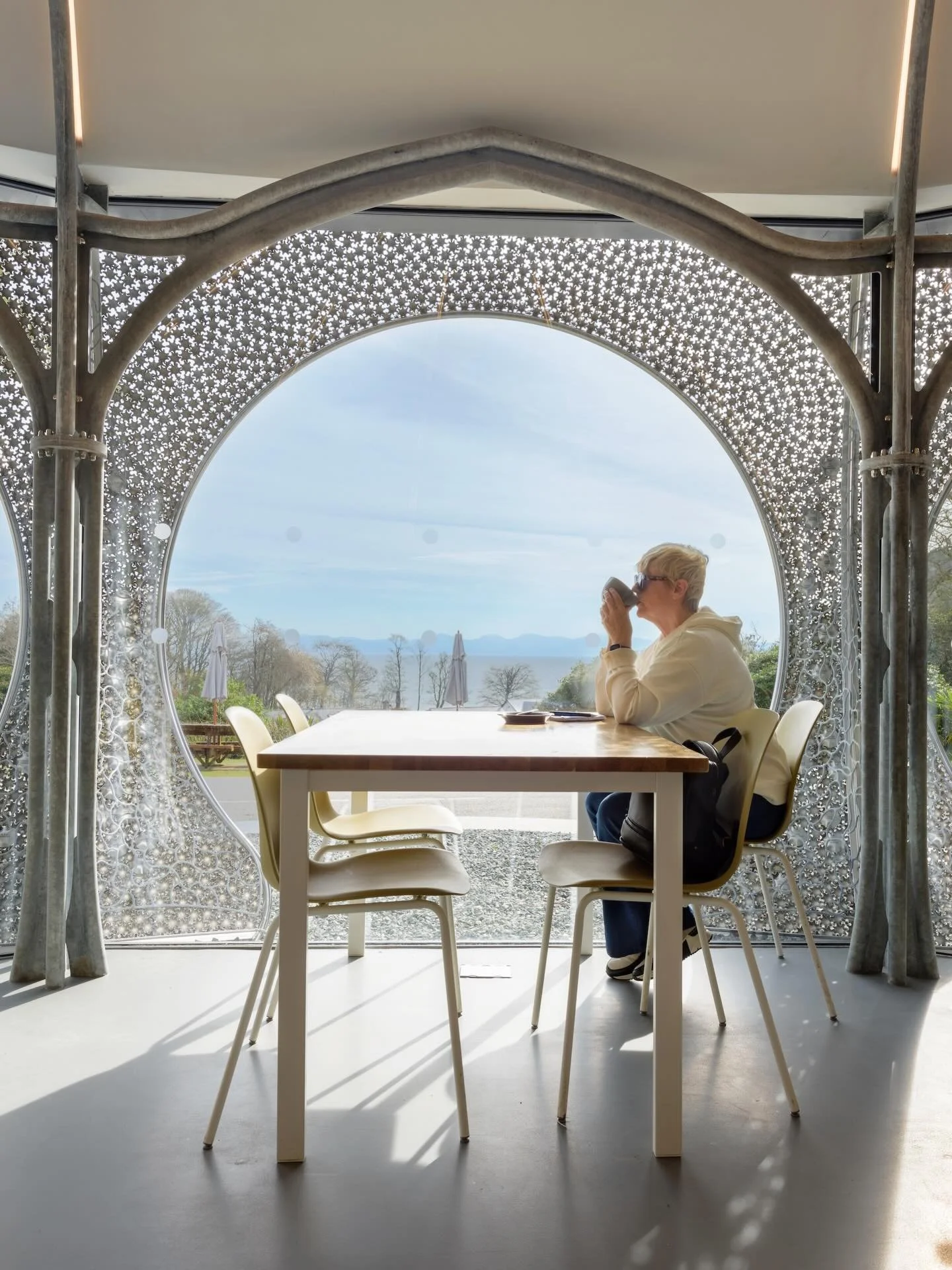 The stunning caf&eacute; at Plas Glyn-y-Weddw features a galvanised structural frame inspired by the Victorian pointed arch doorway of the original House.   Its composition of multiple smaller steel sections echoes the timber mouldings of the glazed 