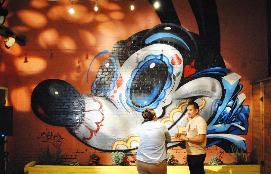 Photo by Asia Morris Mural by Greg "CRAOLA" Simkins