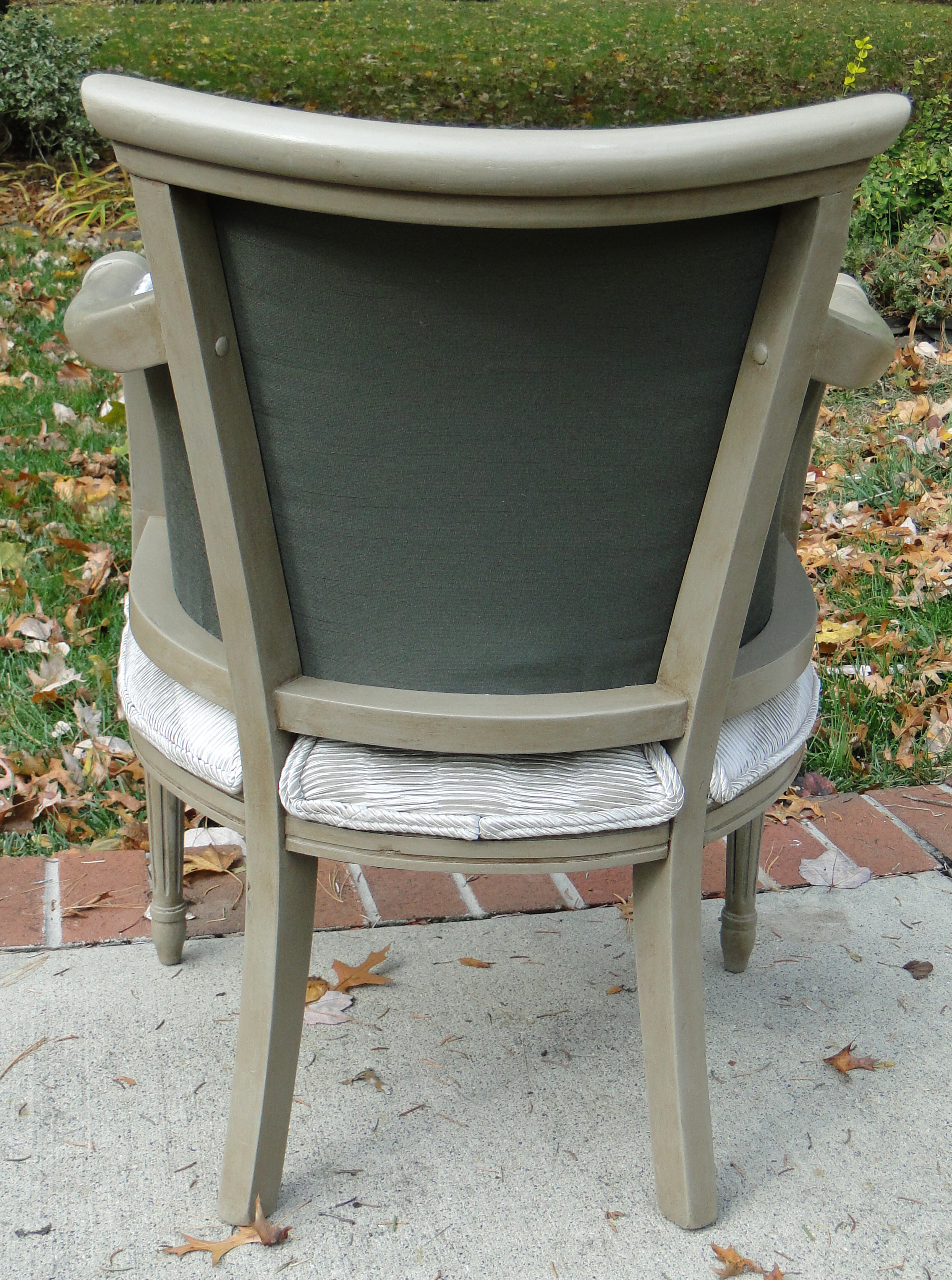 Rear view of chair highlighting khaki fabric
