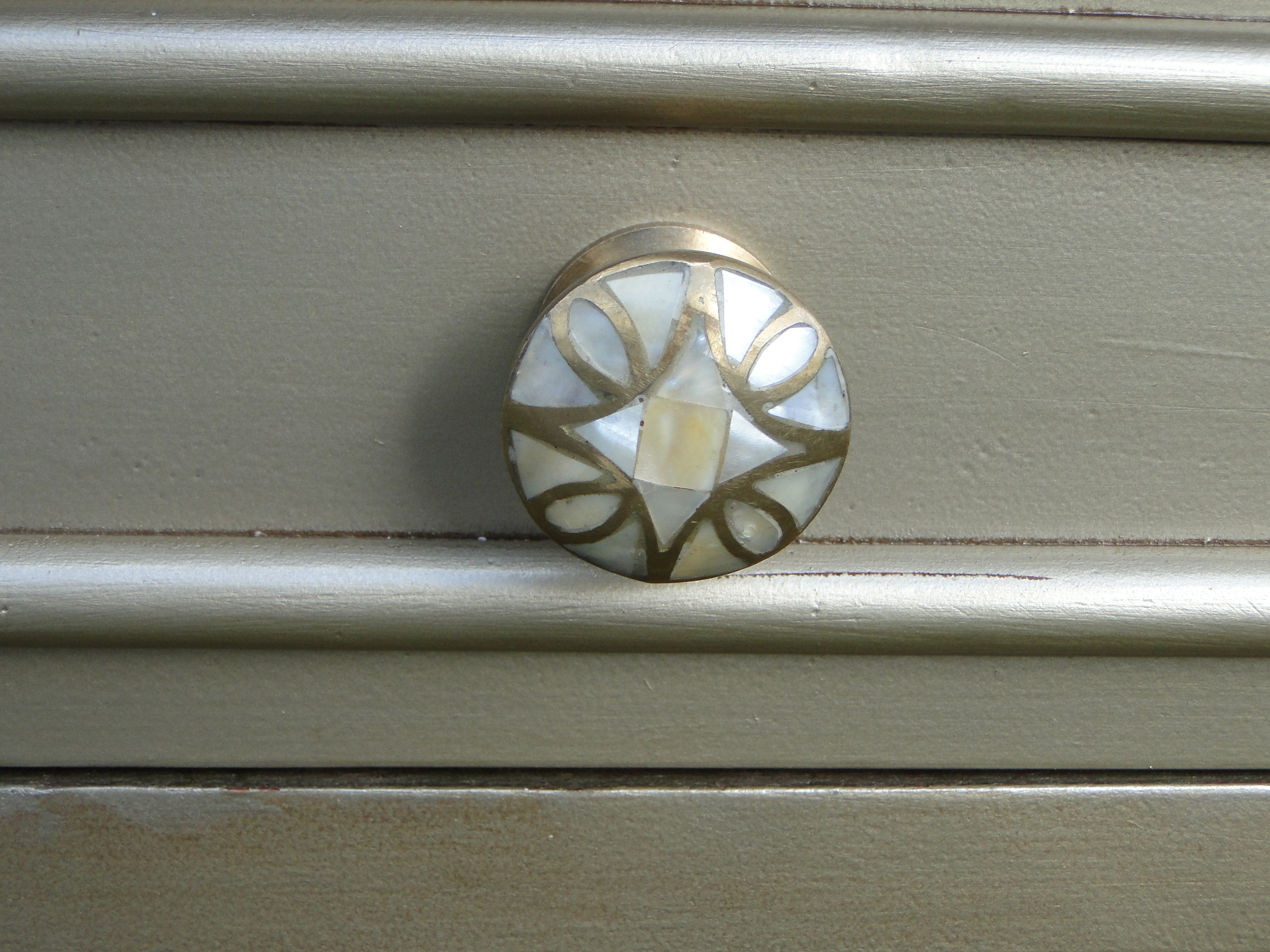 Beautiful mother-of-pearl knobs with gold highlights