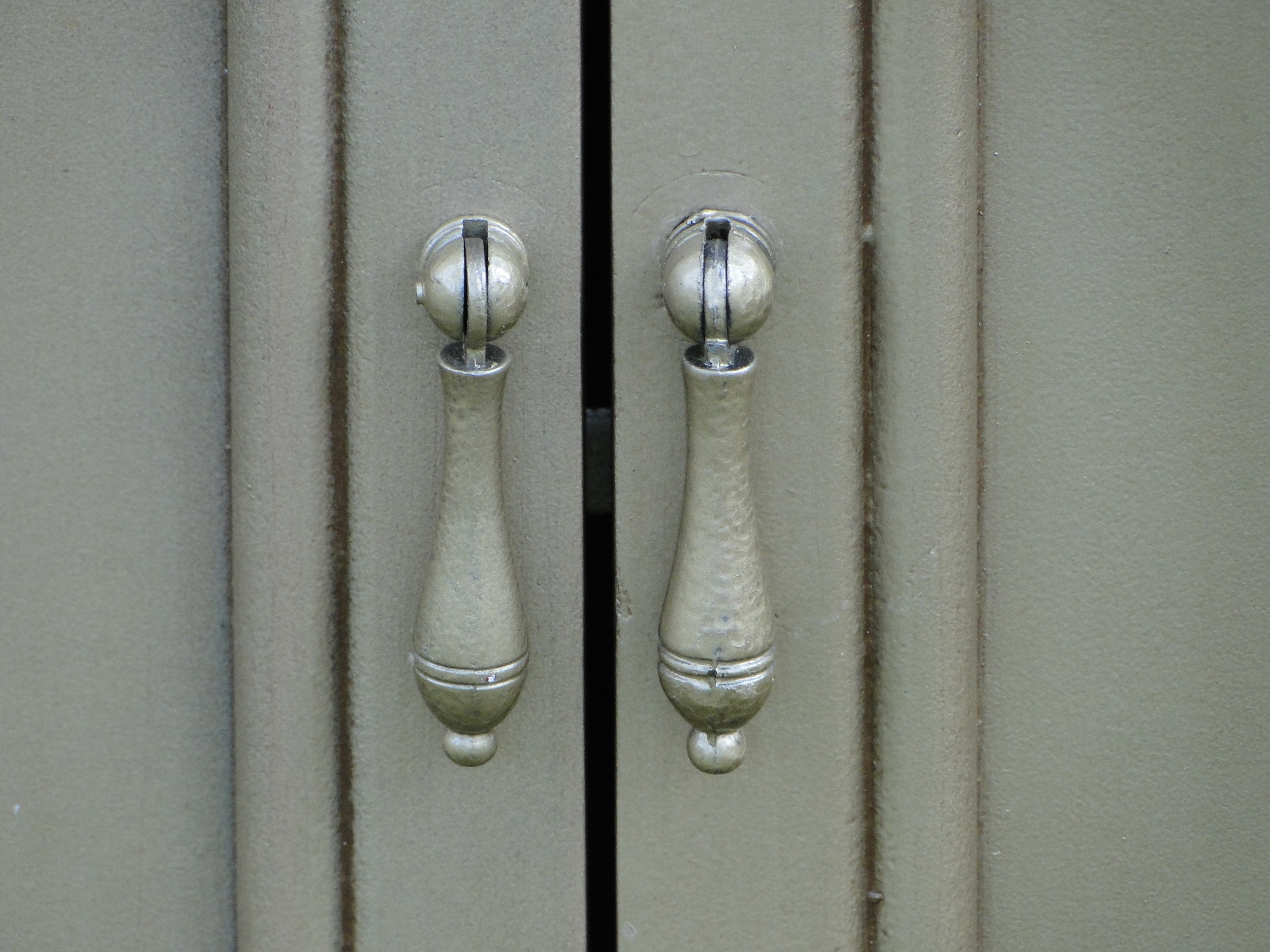Close up of painted cabinet handles