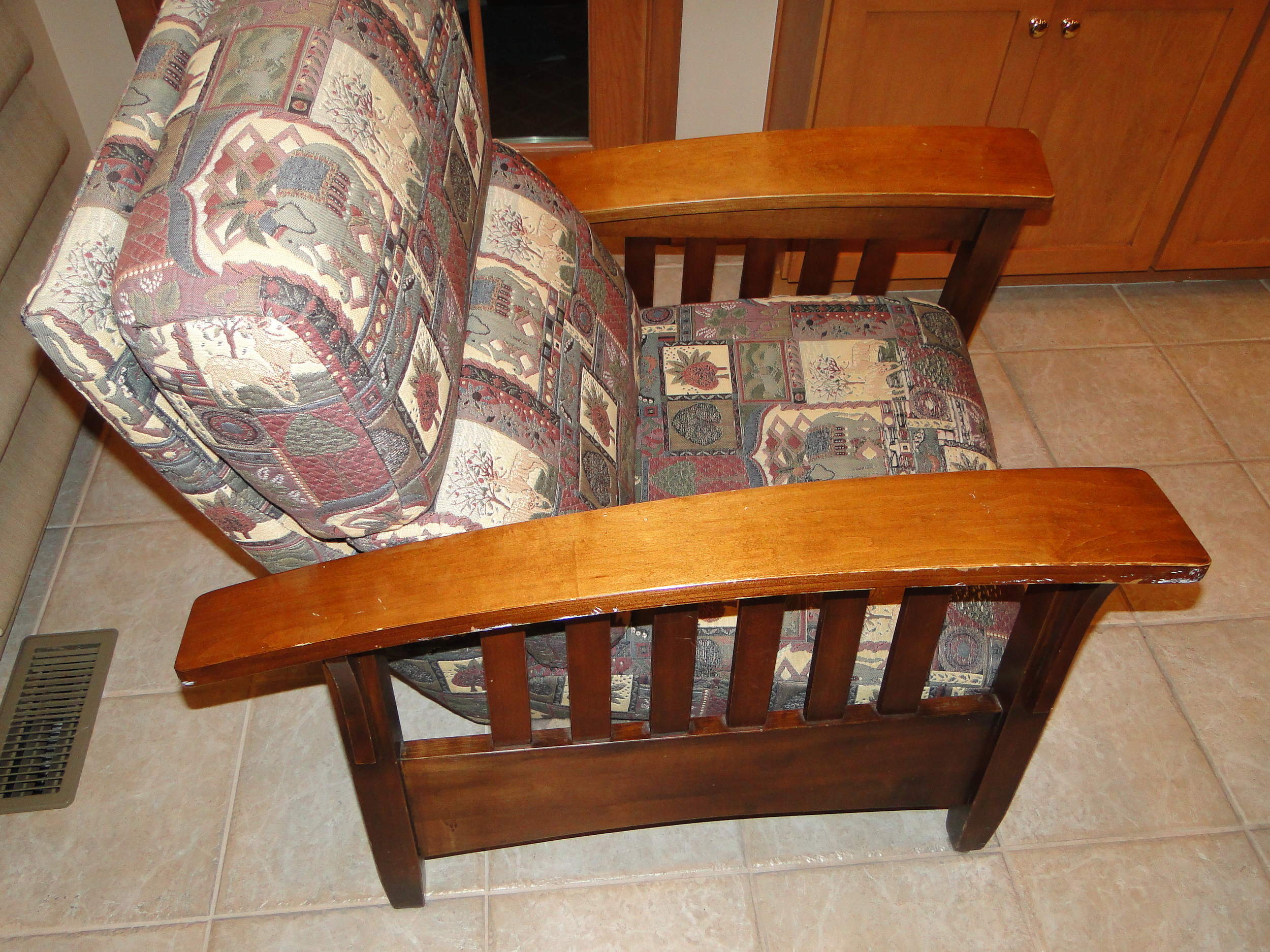 "Before" view with original worn fabric and damaged wood finish