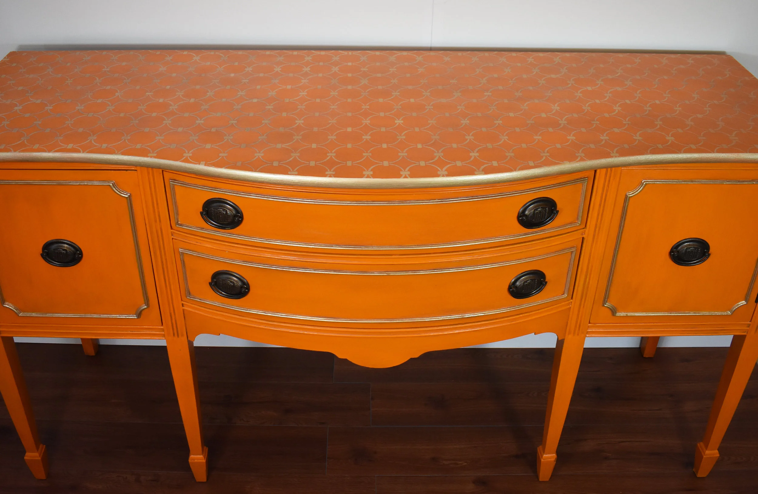 Custom details ... stenciled top, metallic moldings, repainted handles