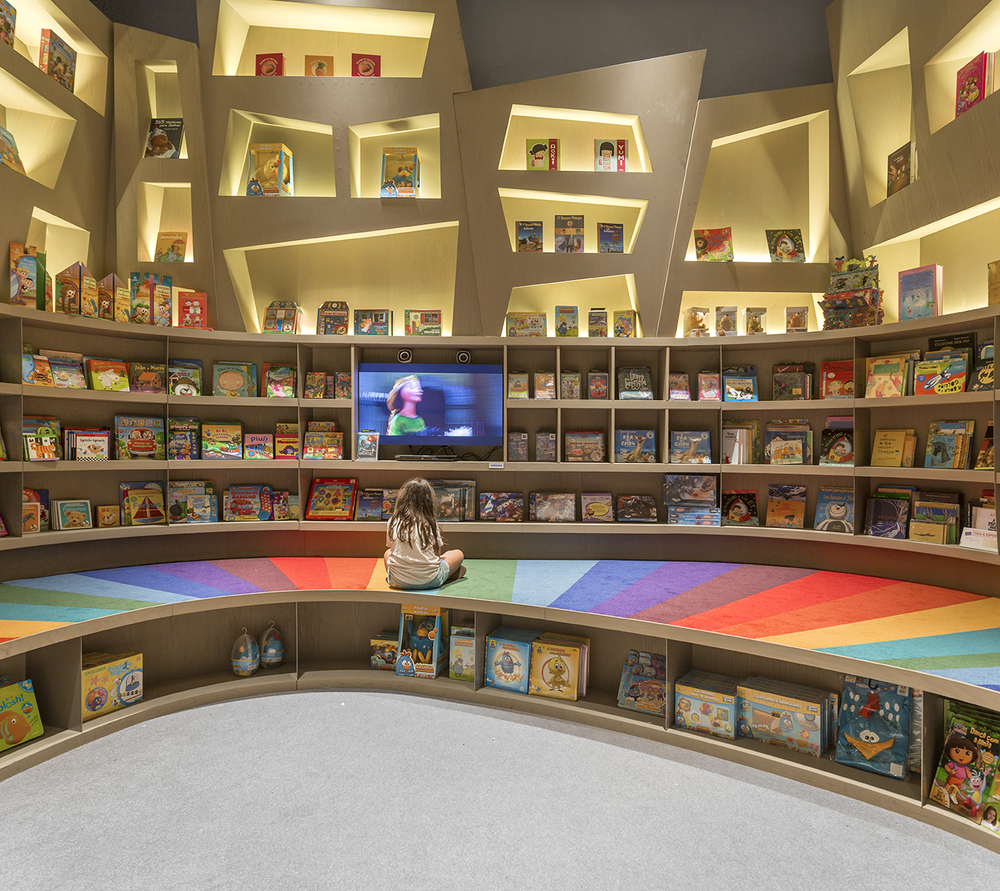  Arthur Casas Designs A Rainbow Twisted Kids Book Den for Saraiva 
