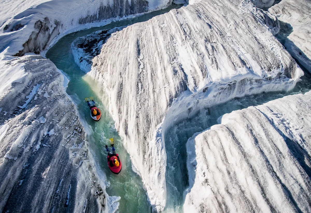 David Carlier photographs Claude-Alain Gailland and Gilles Janin hydrospeeding down the Aletsch Glacier