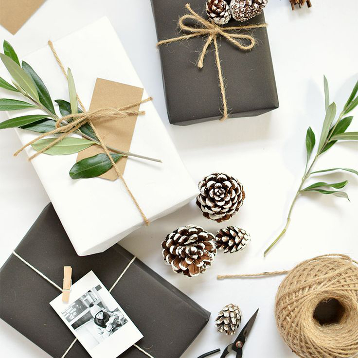 wrap your gifts in matte black gift wrap with leaf