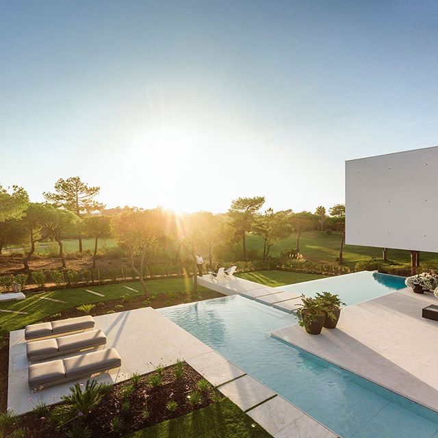 A play on proportions, QL House by Portugal-based @visioarq sits on a sprawling plot of land in #Algarve, the Southern coast of #Portugal. The crisp white two-story house dominates the landscape, it&rsquo;s sharp angles punctuating sweeping gardens, 