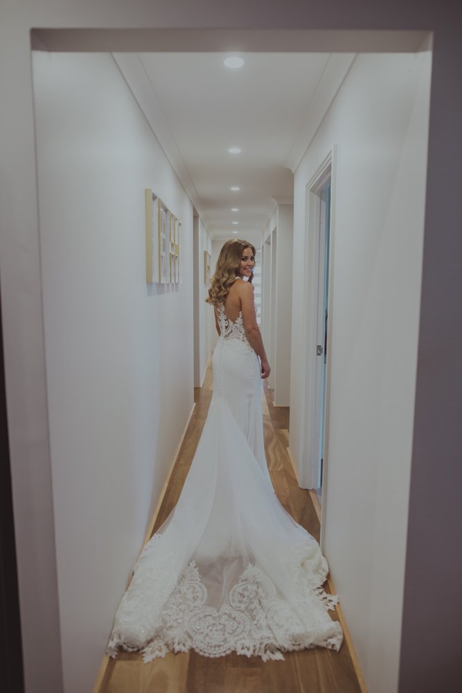 bride walks down hallway