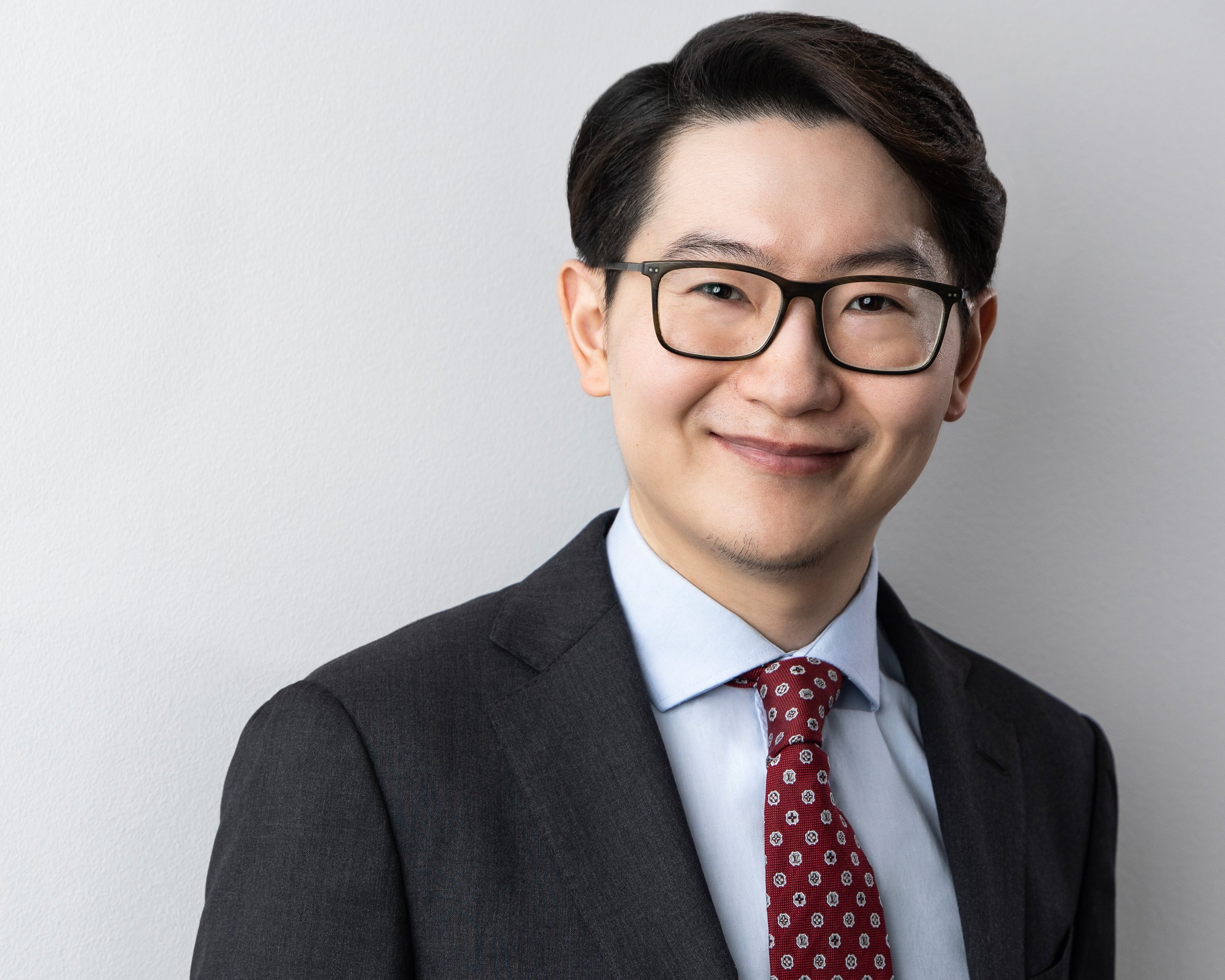 Mens professional headshot with coat and tie