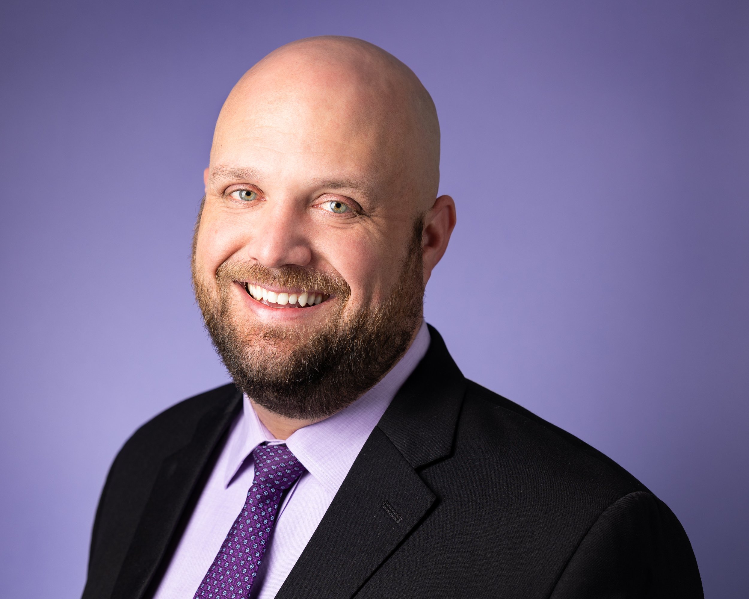 mens headshot on purple background