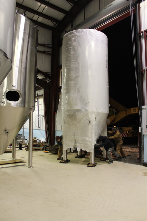  One of the shorter tanks being placed 