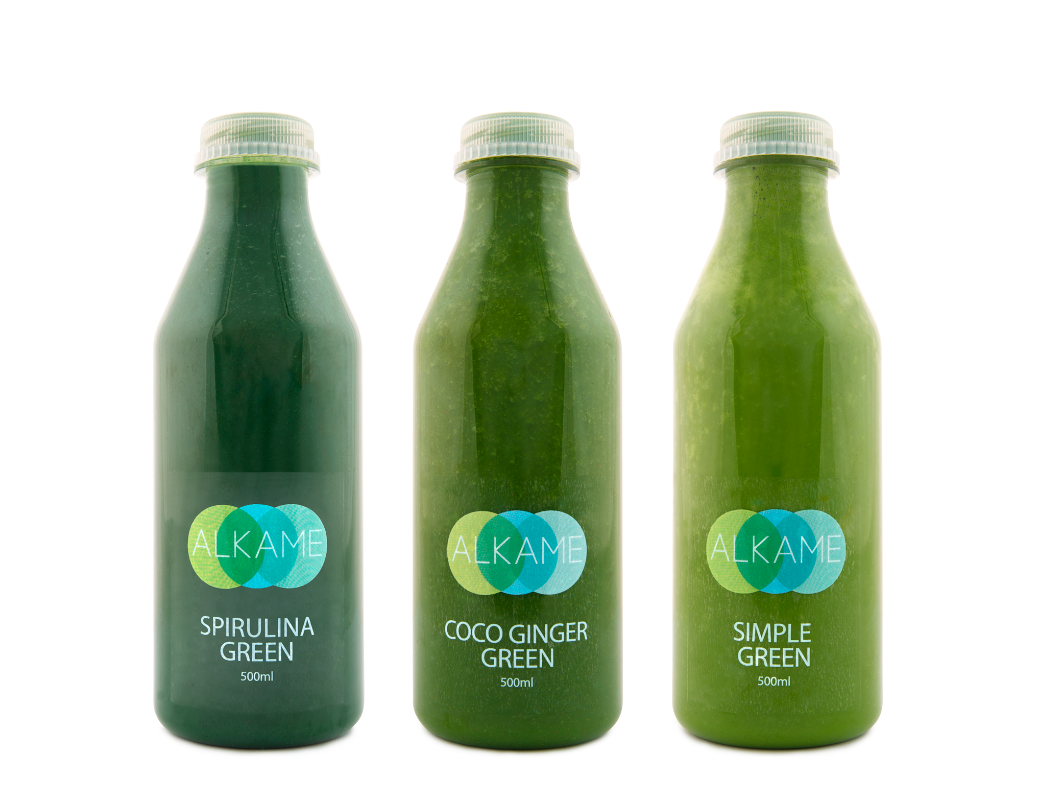 Three bottles of green juice labeled from left to right as Spirulina Green, Coco Ginger Green, and Simple Green, each 500ml, with a white background and a geometric logo reading "ALKAME."