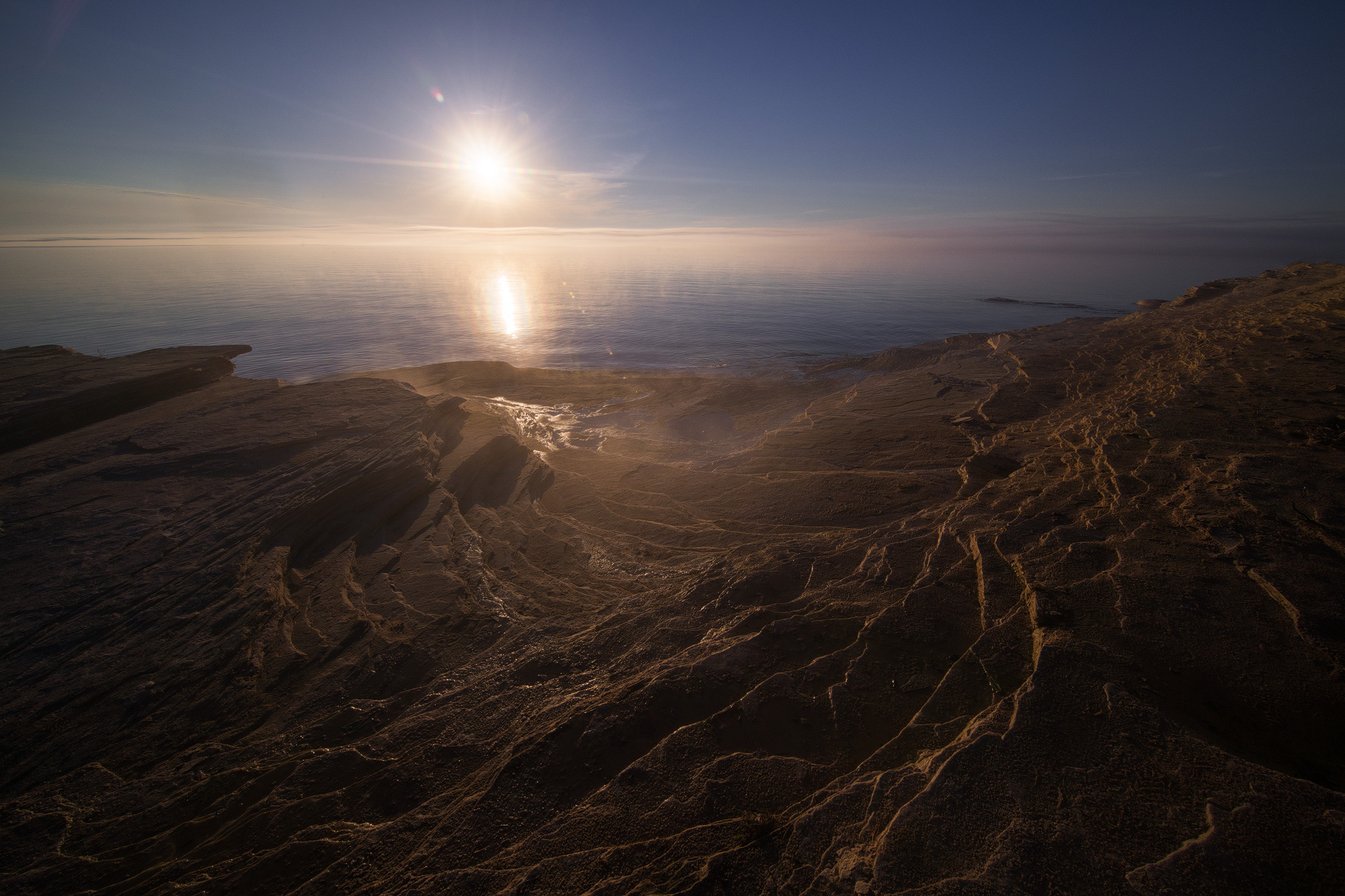 Flare seems well controlled, this is a single shot with no flare spots removed. Be aware the sun can be well out of your frame and still create flare spots in a lens this wide. 