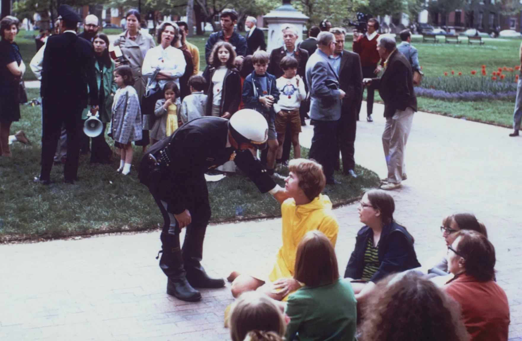Mrs. Eleanor McPhillips confronted by a police officer during a sit-in against the Vietnam war in Lafayette Park, May, 1970.