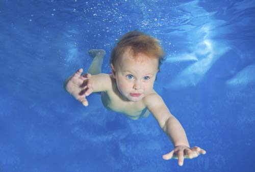 Evie underwater at a photo shoot at Mentmore Country Club.