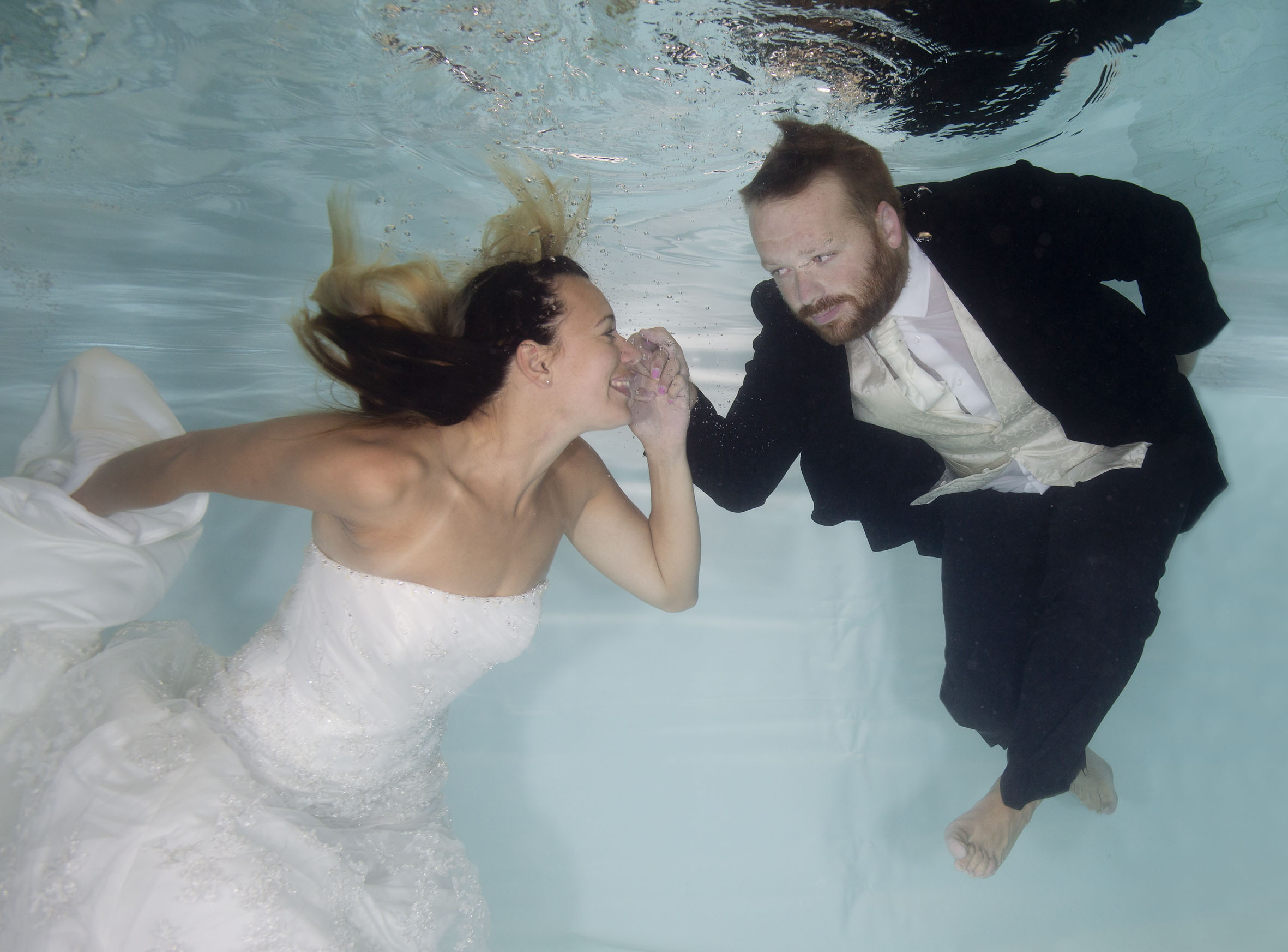 Becky and Keith jumped in the pool in their wedding clothes!