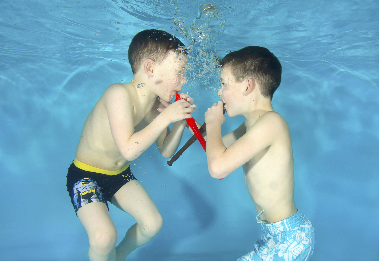 Brothers Harley Magee, 8 and Zack Magee, 6, play underwater recorders at a Starfish Underwater Photography photo shoot with Tadpole Tots swim school, in Farnham, Surrey.
Starfish Underwater Photography holds underwater photo shoots in many locations around England. All babies and children taking part have practiced underwater submersions and are taking swimming lessons.
Photo by Lucy Ray/www.starfishunderwaterphotography.com