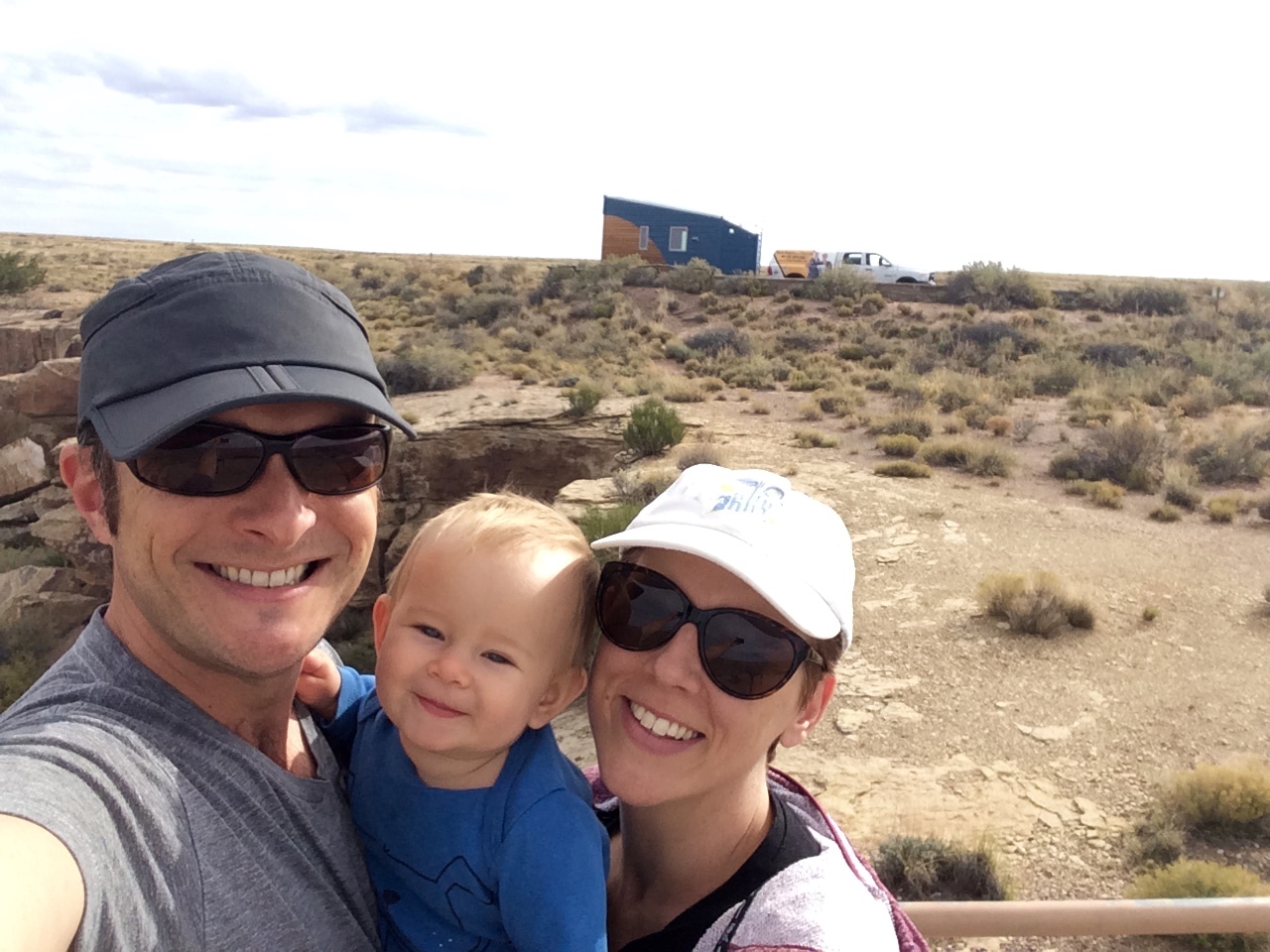 Corbett, Nanette, and Grace with #TinyLab in the background at the Petrified Forest in Arizona.