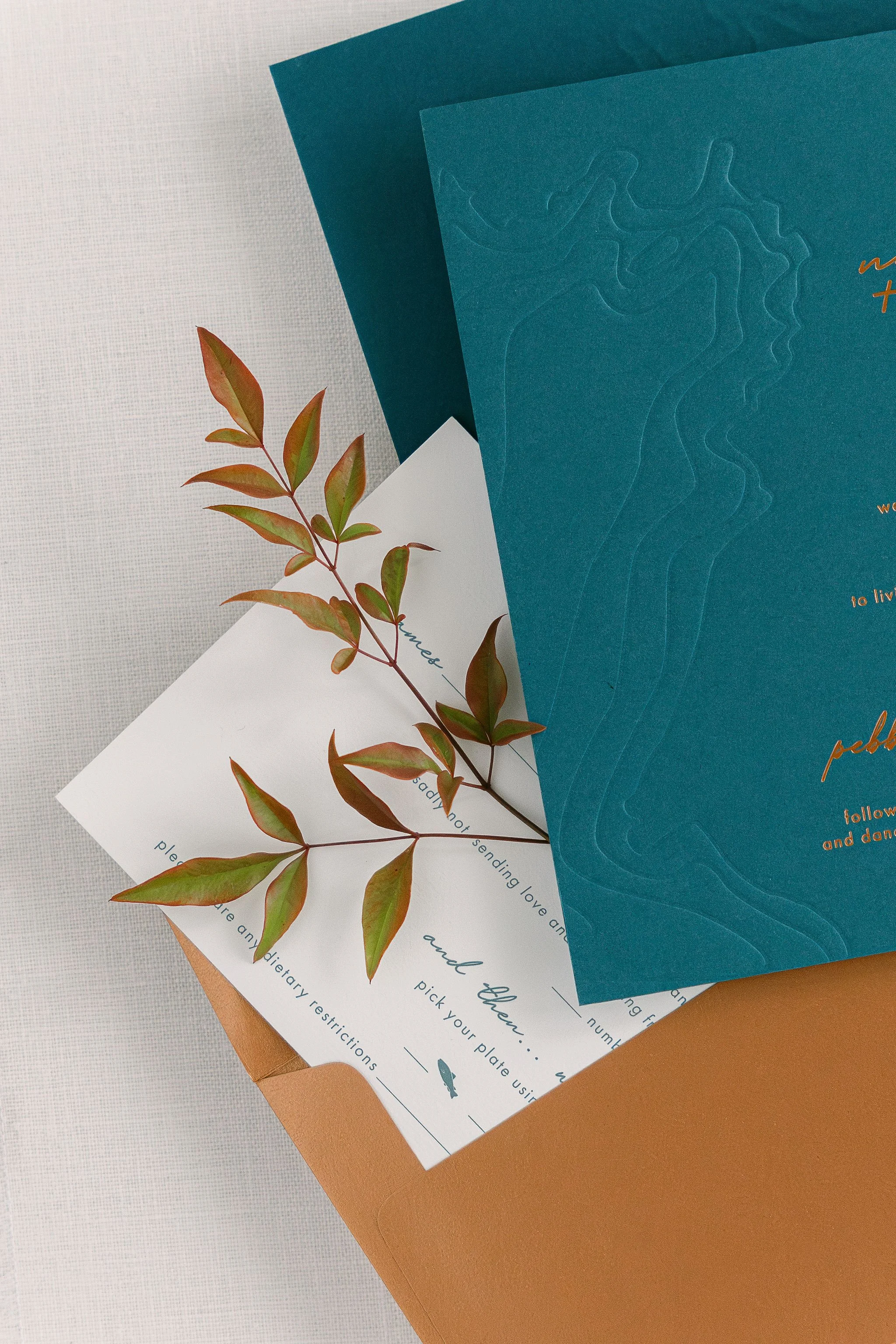 Copper and green wedding invitation stack