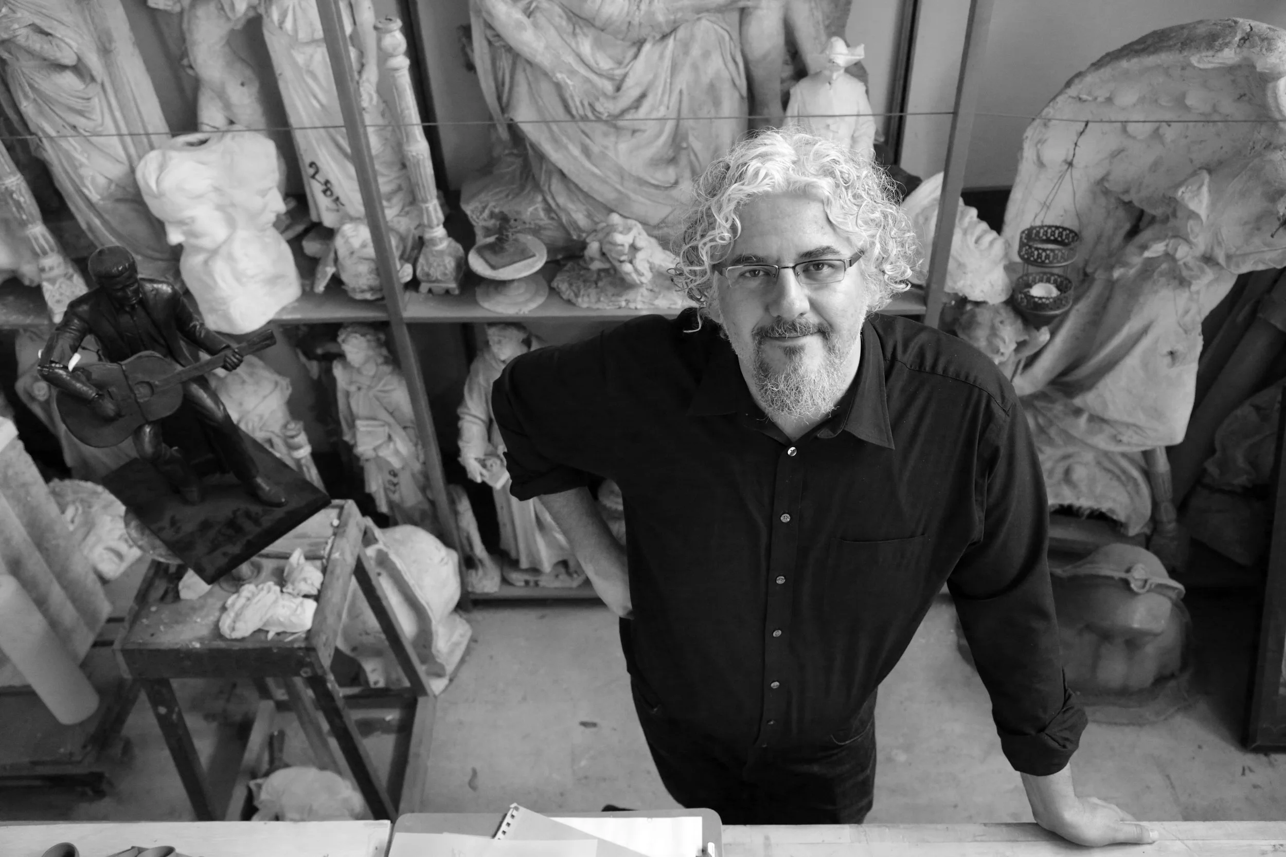 After studying under his father artist Jesus Romo from the age of 10, Adan attended the University of California at Berkeley where he received a BA in Art History with a focus on Renaissance sculpture. During his studies he spent a year in the Venetian region at the University of Padua, Europe’s second oldest University and where Galileo taught. In 2001 Adan was named a Rotary Ambassadorial Scholar, giving him the opportunity to study in Italy under Mirio Viviani, marble artisan for Henry Moore, Mitoraj and Botero, and to attend the Academy of Art in Rome. Needless to say Italy has been integral to Adan’s formation as an artist. From an early age Adan has received many major national commissions, ranging from artwork for civic buildings and religious institutions, to designing memorials for veterans. In addition to creating public works of art, Adan is owner of ROAMN, a travel company focused on crafted experiences throughout Italy.