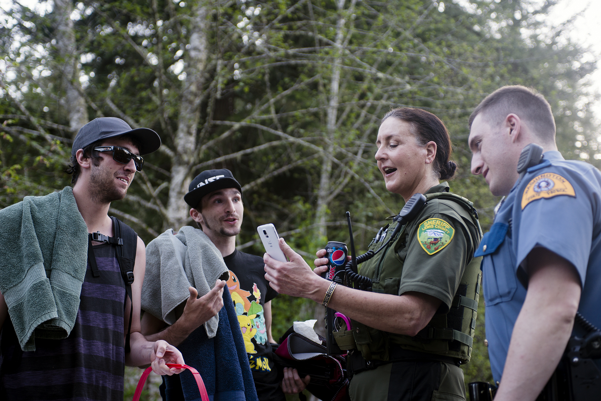  "I'm more like these people than the people in big cities," said Lewis County Sheriff's Deputy Sue Shannon, who also lives in a remote part of East Lewis County. "We connect and once we connect its made my job easier."  A couple of men in their earl