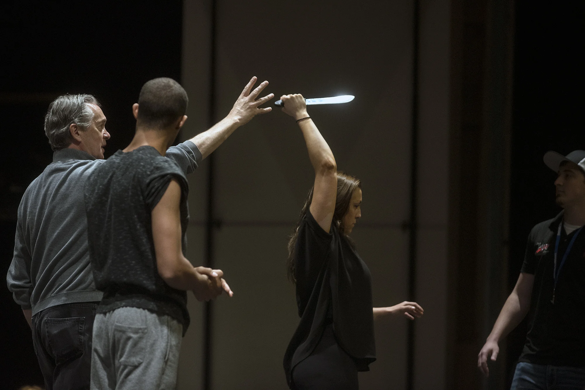  Brian Tyrrell, the director of "Once on This Island", works with Austin Fuentes, center-left, playing the role of Papa Ge, and Megan Tyrrell, playing the role of Ti Moune, during a rehearsal on Tuesday, April 19 at Corbet Theatre in Centralia. Brian