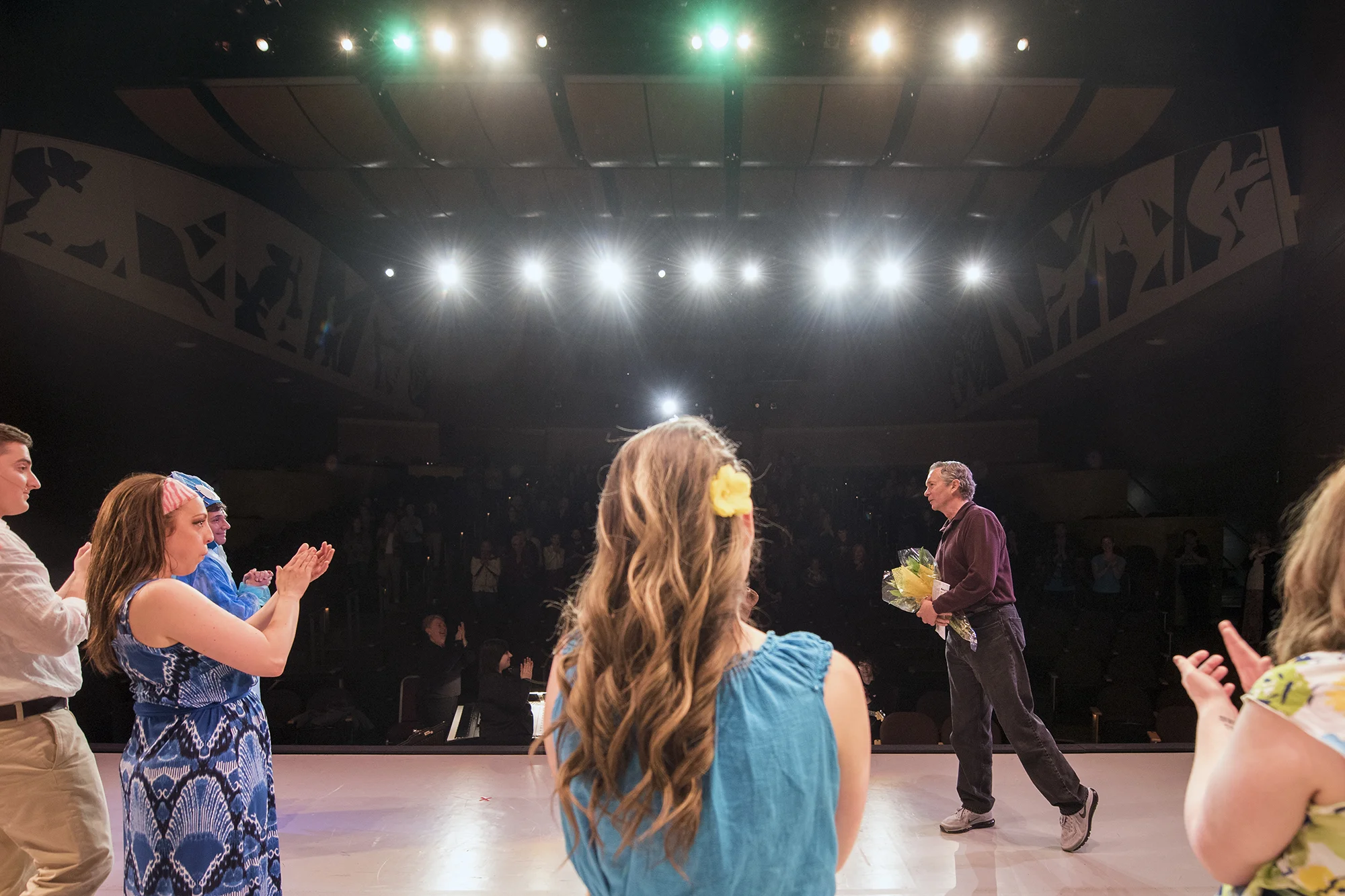  Brian Tyrrell, the longtime head of the Centralia College Drama Department, gets a standing ovation while being recognized by his cast after the final performance of "Once on This Island" on Saturday night at the Corbet Theatre. After 25 years, Satu