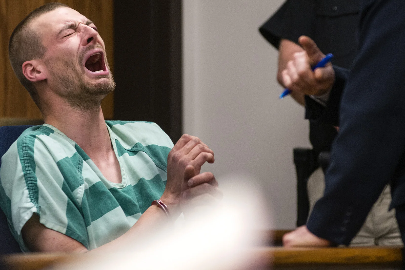 Norman Gastfield reacts after public defender Robert Schroeter explains that he has been charged with first-degree child rape prior to his initial appearance in Lewis County Superior Court on Wednesday, April 23, 2014, at the Lewis County Law and Justice Center in Chehalis, Wash.