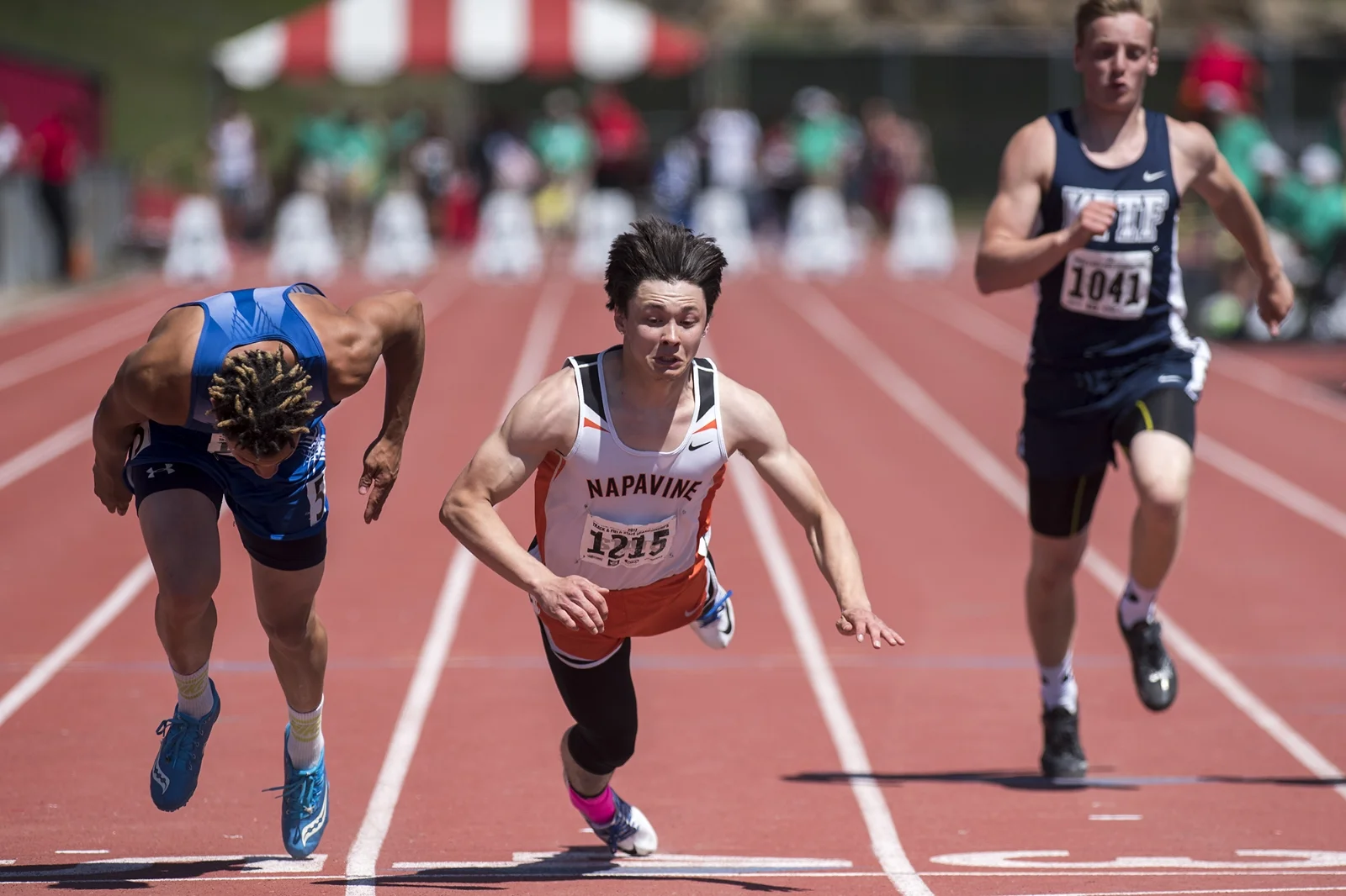  Napavine's Conner Locke dives over the finish line to beat Lyle/Wishram's Brandon Montoya, left, by 1/100th of a second in the State 2B Boys 100-meter dash final on Saturday, May 27, 2017, at Roos Field in Cheney. 