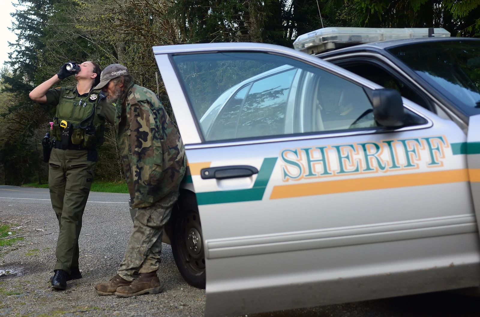  As Richard Jacoby finished his cigarette, Lewis County Sheriff's Deputy Sue Shannon guzzles the last bit of her Pepsi Max before the pair head to Mossyrock. Just 30 minutes earlier Jacoby was arrested for alleged possession of methamphetamine and su