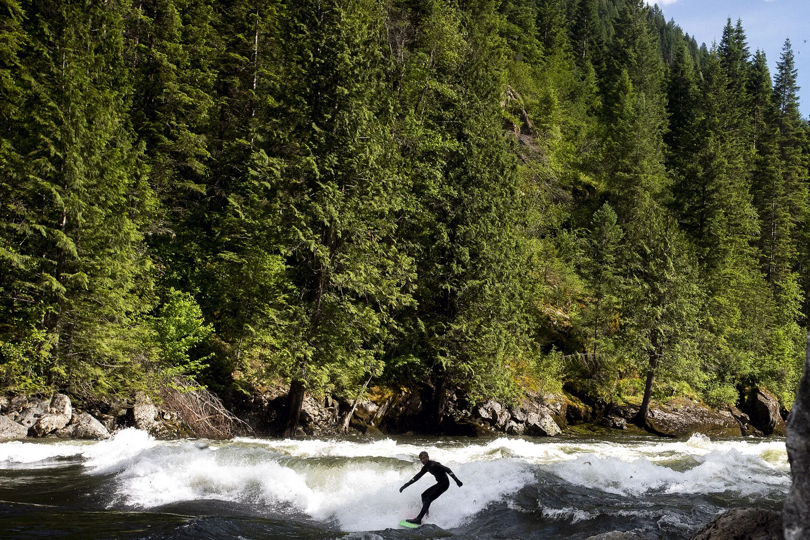 Charlie Cindric, of Spokane, Wash., surfs the Lochsa River pipeline on Sunday, June 3, 2018, near Lowell, Idaho. According to fellow surfer John Brown, of Boise, when water levels are running between 5,000 cubic-feet-per second and 12,000 cfs the river creates an ocean-like wave for surfers or kayakers. On Sunday, the river was running at 9,500 cfs.