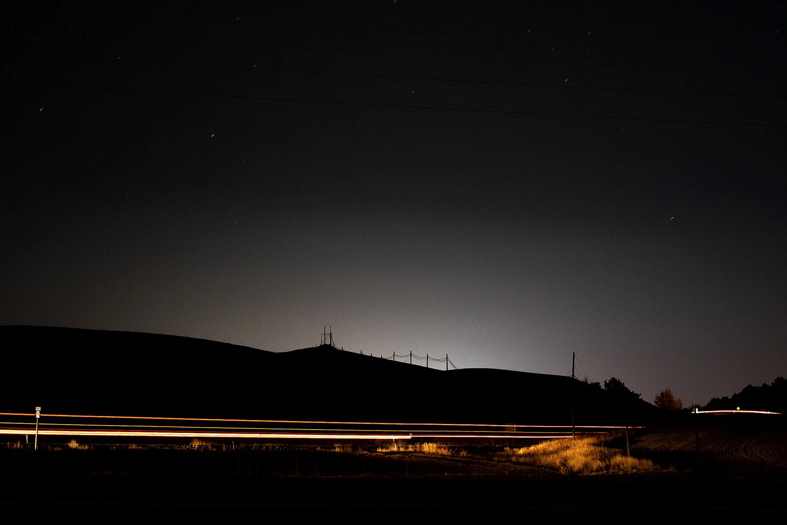 The glow of Pullman resonates over the hills of the Palouse as cars head into town late Friday, Oct. 19, 2018, in preparation for a big Cougar football weekend featuring ESPN’s College GameDay and a PAC-12 Conference affair against the Oregon Ducks.