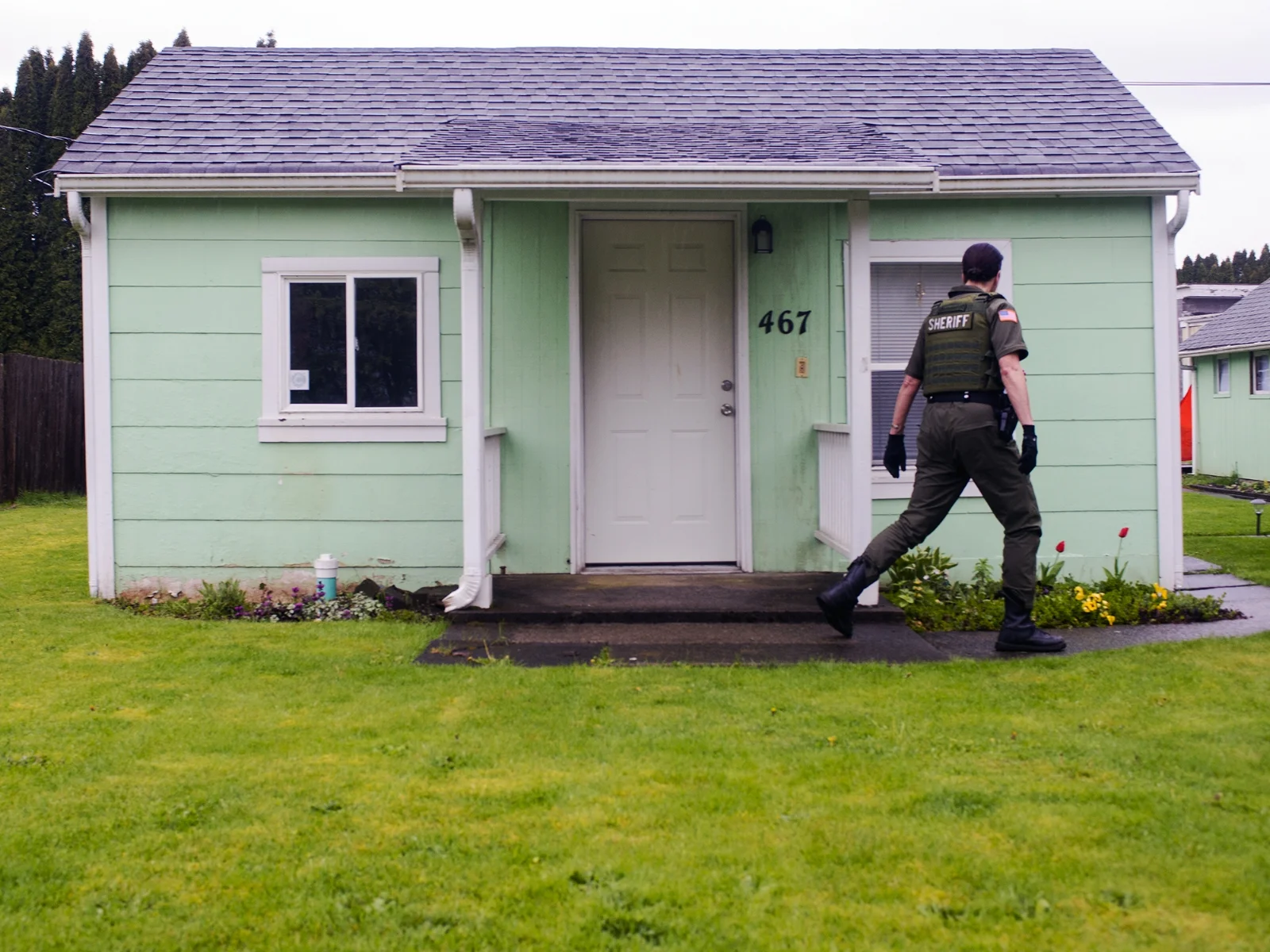  "People spread rumors that I can jump over cars and run a 60-second 440 (-yard dash)," said Lewis County Sheriff's Deputy Sue Shannon. "I let (the rumors) go and they don't which rumors are true or not."  Shannon walks away from the front door after