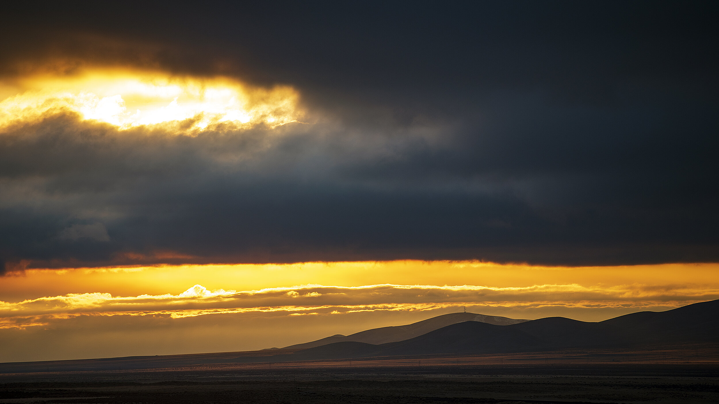  Low lying clouds accompanied my dad and I through much of Eastern Oregon, but once we got south of Winnemucca, Nevada we were treated to a little sunlight at the southern edge of the Santa Rosa Range. 