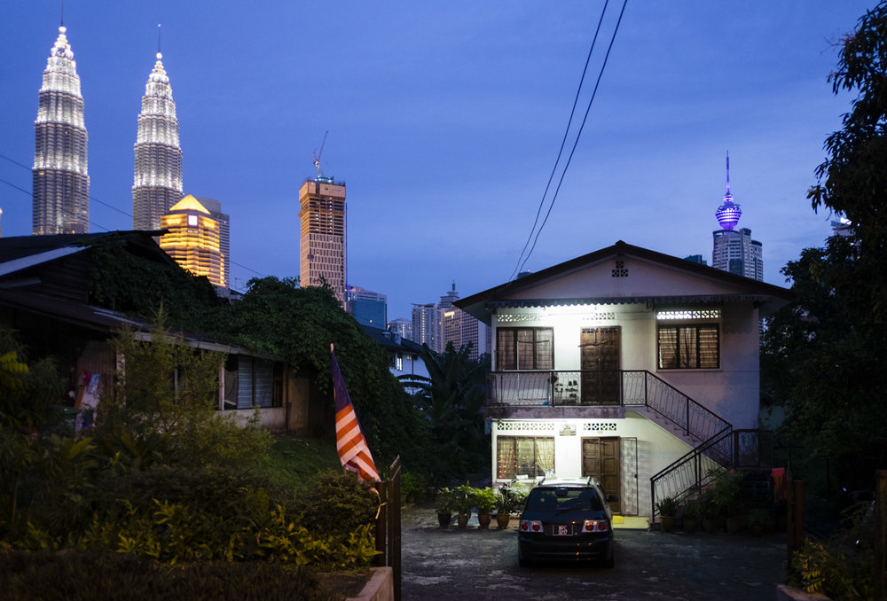 The Petronas Towers with KL Tower on the right as seen from Kampung Baru, Kuala Lumpur.