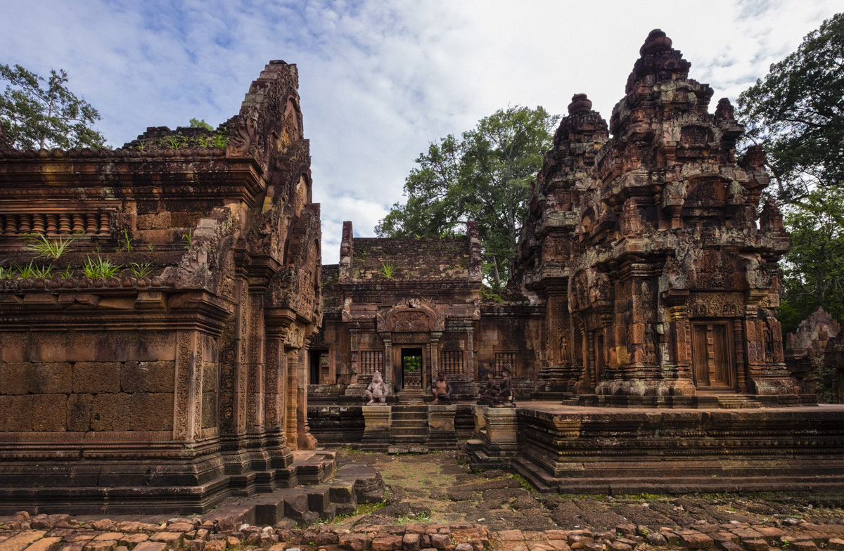 Banteay Srei is built largely of red sandstone, a medium that lends itself to the elaborate decorative wall carvings which are still observable today. Angkor, Cambodia