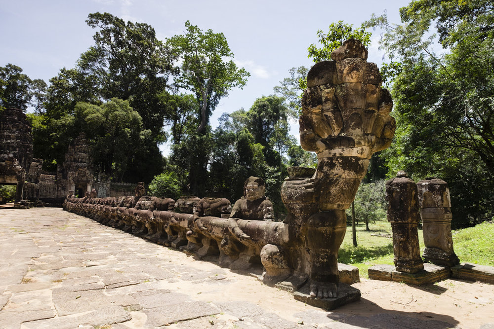 The entry bridge at Preah Khan (meaning "Royal Sword") is a temple at Angkor, Cambodia, built in the 12th century for King Jayavarman VII to honour his father. 