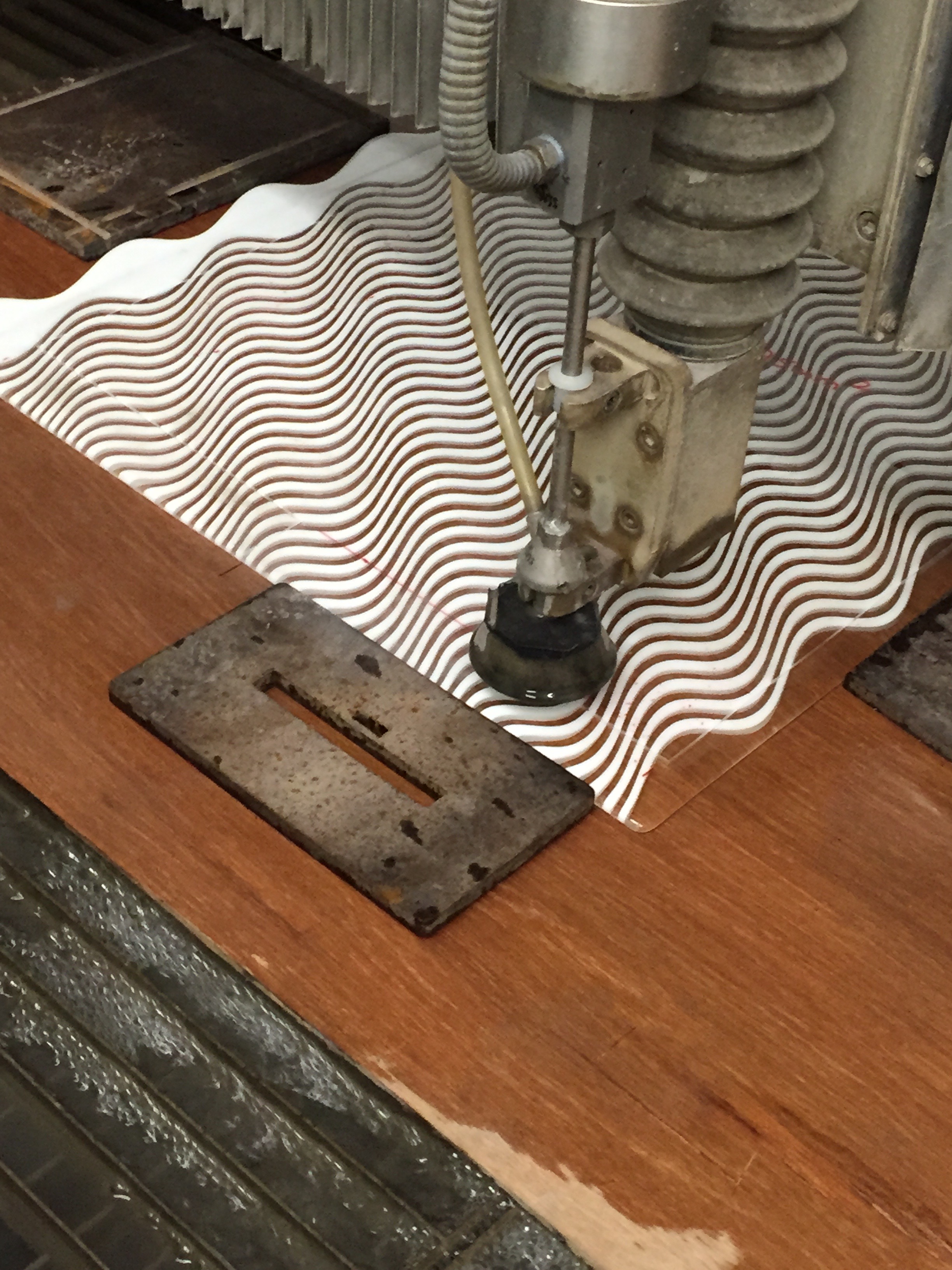 Cutting the outer edge to create a simple square. The water jet cutter in action takes around 10 minutes for this process.