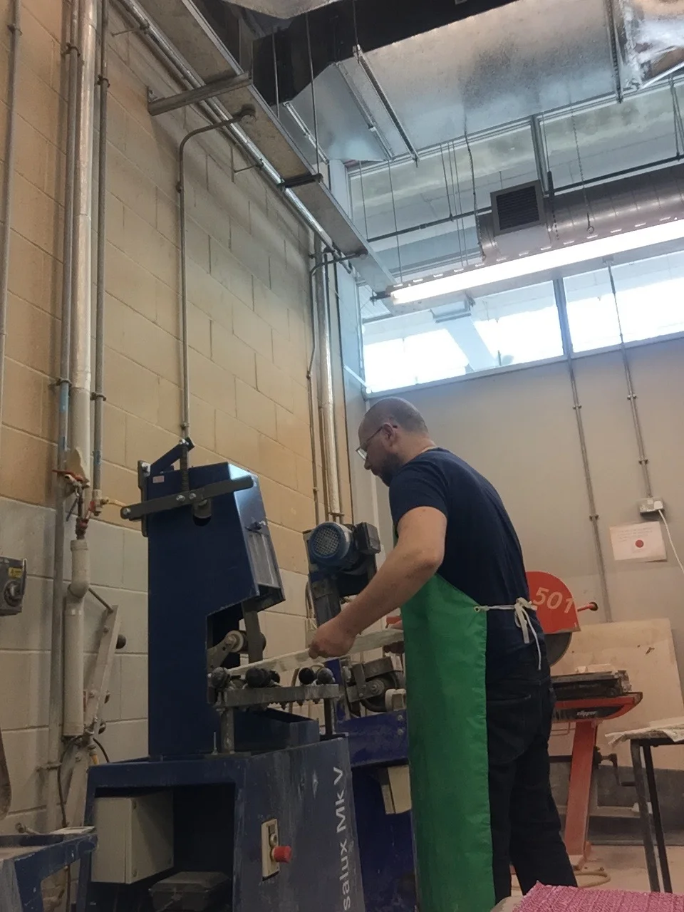 Cold working the glass edge to give a smooth clear edge so when the piece is fire again will polish leaving and beautiful clear edge.