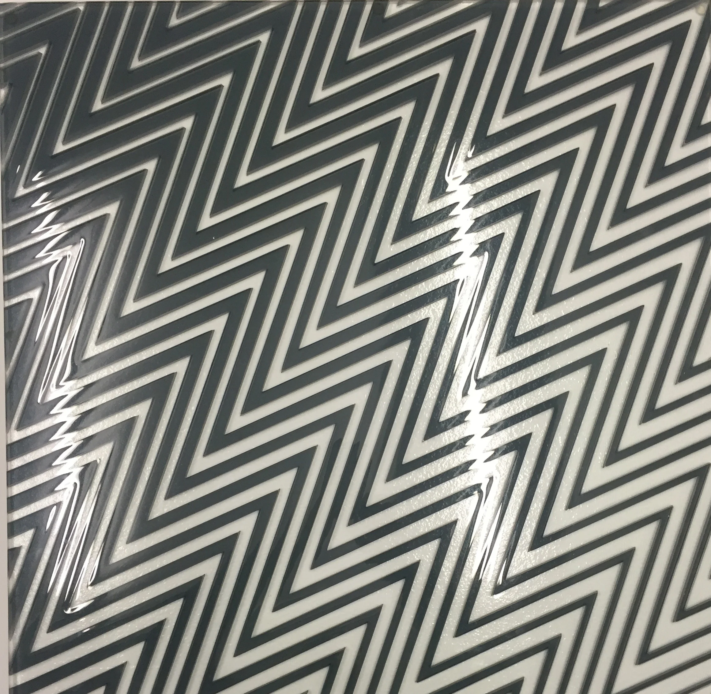 This creates a transparent sheet, the edges of which are polished using diamond tools before a penultimate process of industrial laminating to comply with British Standards.