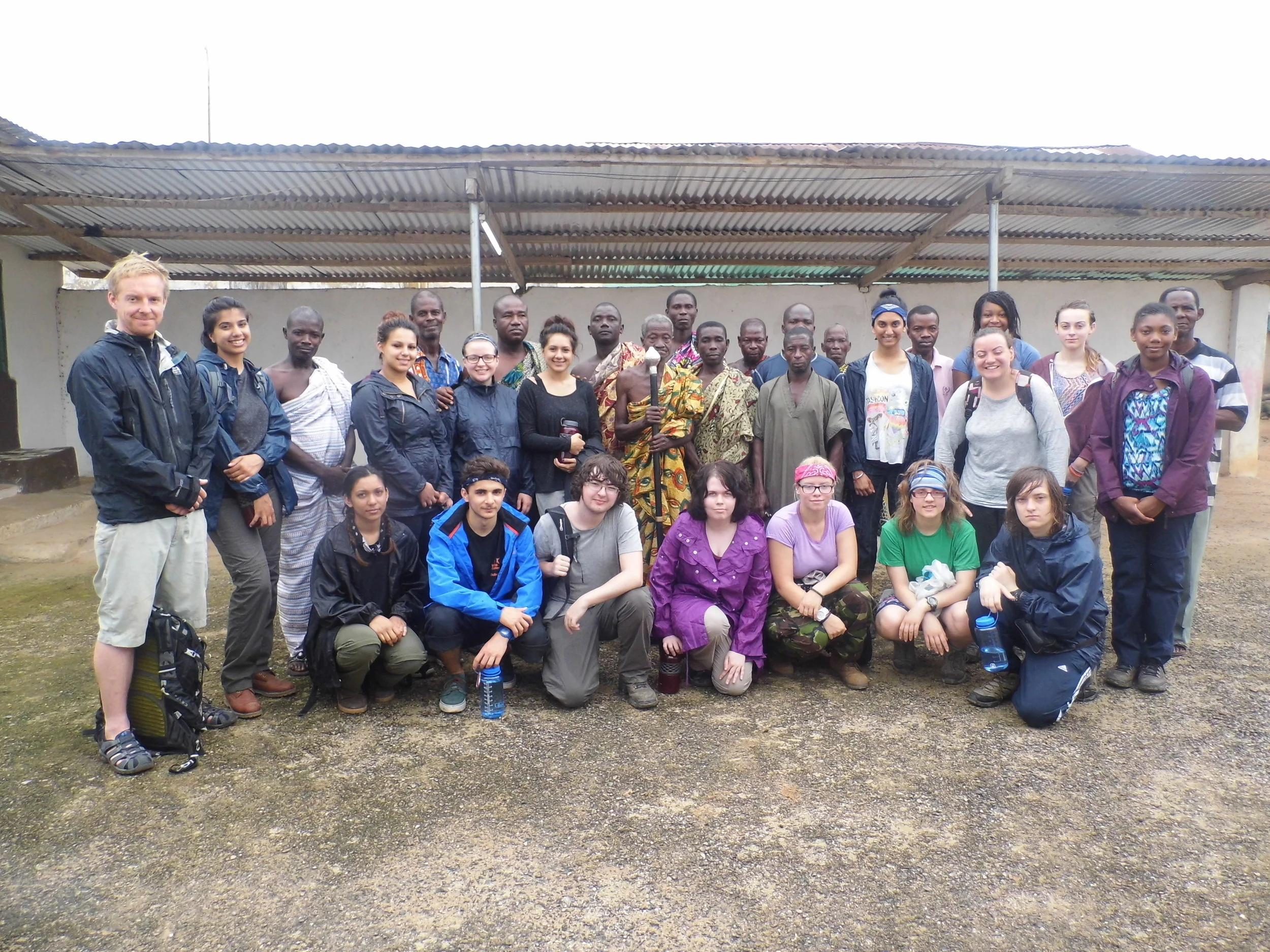 Miss Green and Miss Evans with the fourteen students and local helpers.