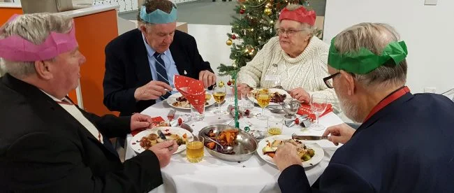 Students cook up festive feast for veterans